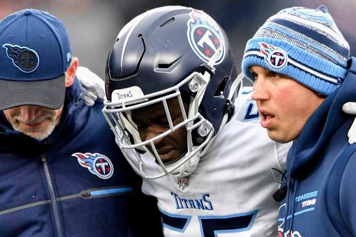 Tennessee Titans linebacker Monty Rice (56) is helped off the field during the second quarter at Gillette Stadium Sunday, Nov. 28, 2021 in Foxborough, Mass.